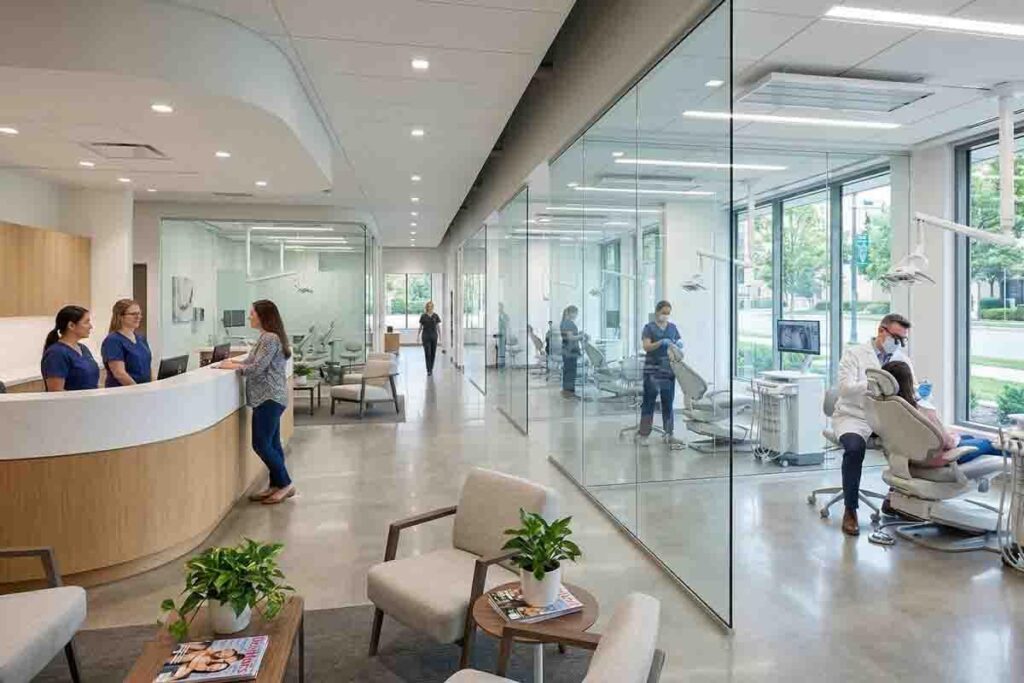 A high-resolution, realistic photo of a large and modern dental clinic interior. The space features a sleek curved reception desk, glass-walled treatment suites, and a professional, sunlit atmosphere. The text "Marketing for Dental Clinics" is elegantly overlaid in a sophisticated, minimal font, aligned with the CiCon Marketing aesthetic.